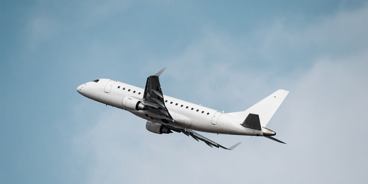 Rear underside perspective of jet ascending with wings flexed and landing gear retracted, emphasizing power, aerodynamics and takeoff performance.