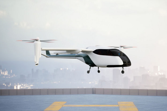 eVTOL vehicle hovering over a vertiport landing pad