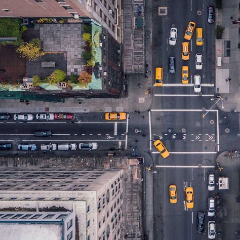 An aerial view of NYC streets with yellow cabs.