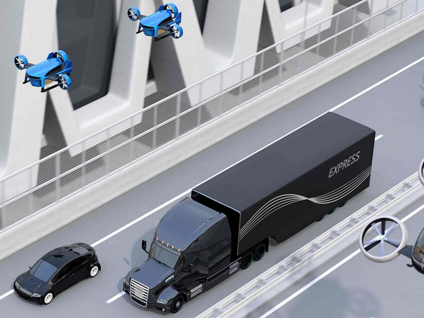 An illustration of a black truck being followed by flying drones