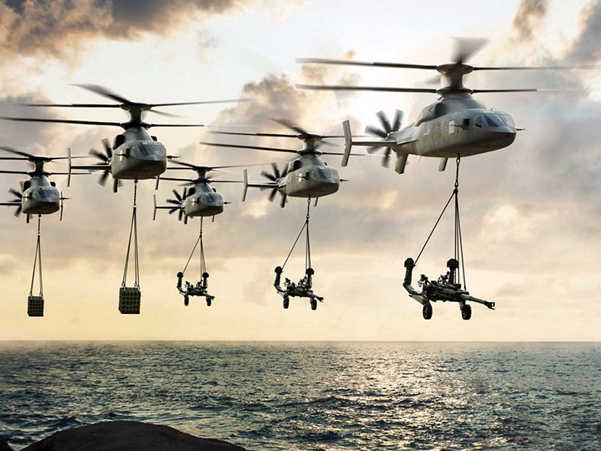 Helicopters flying over the ocean