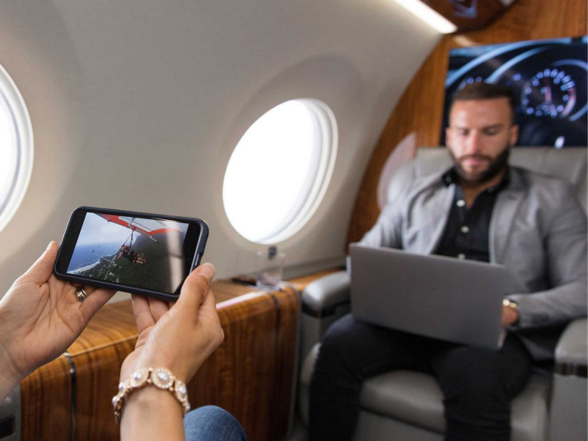 Passenger using iPhone in Cabin