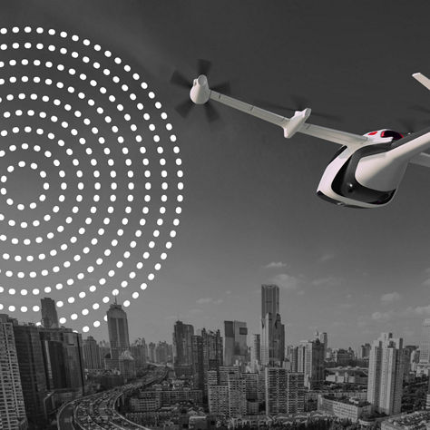 eVTOL aircraft flying toward a modern city skyline during daytime