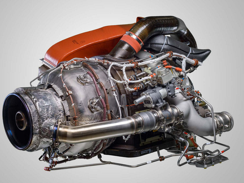 Close-up of a 131-9 APU aircraft engine displayed against a neutral gray background.
