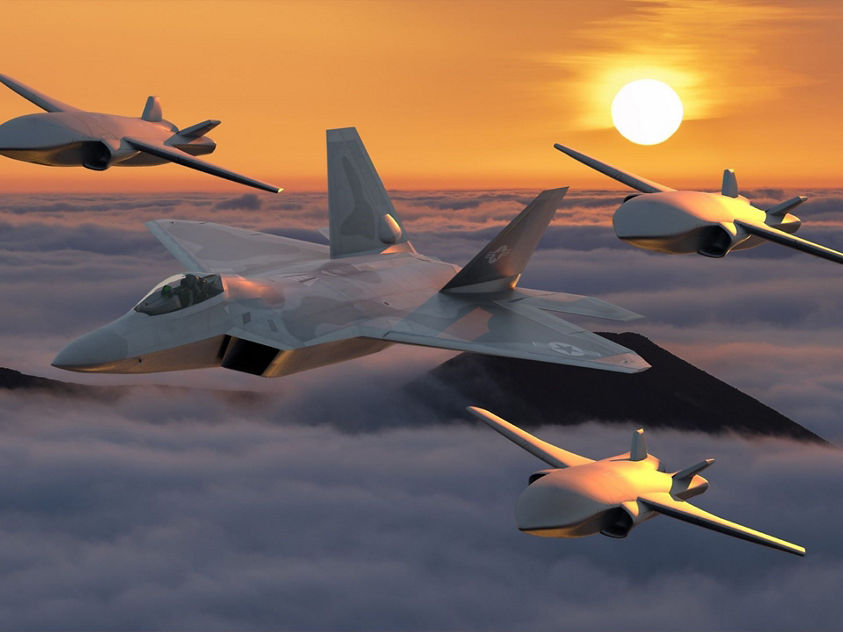 Cutting-edge military aircraft and UAVs flying in formation above clouds during a stunning sunset.