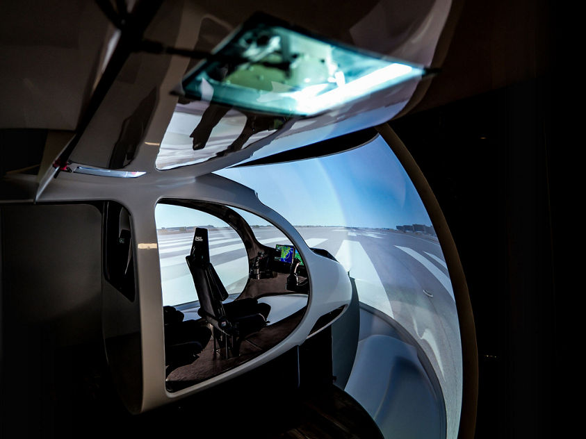 Explore a next‑generation aircraft cockpit with advanced avionics, panoramic displays and innovative design supporting future air mobility and precision navigation.