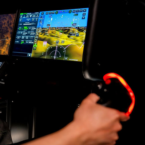 Individual showing a demo on the Anthem Flight Deck using a controller.