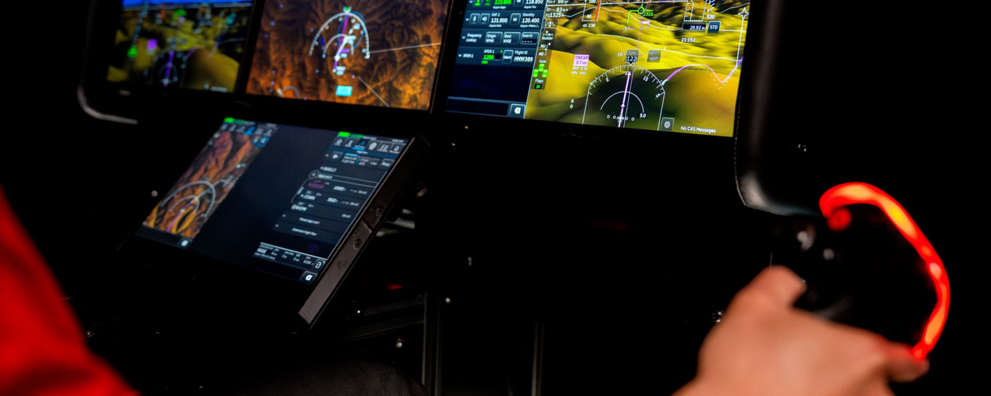 Individual showing a demo on the Anthem Flight Deck using a controller.