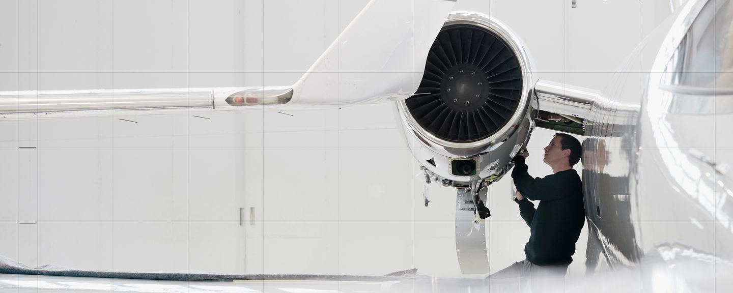 technician conducting maintenance on a Bombardier Global 5500/6500 business jet.
