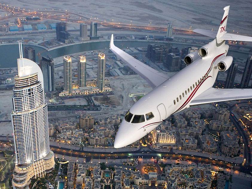  Business jet featuring Honeywell Aerospace avionics flying above a modern cityscape, highlighting advanced navigation and flight systems.