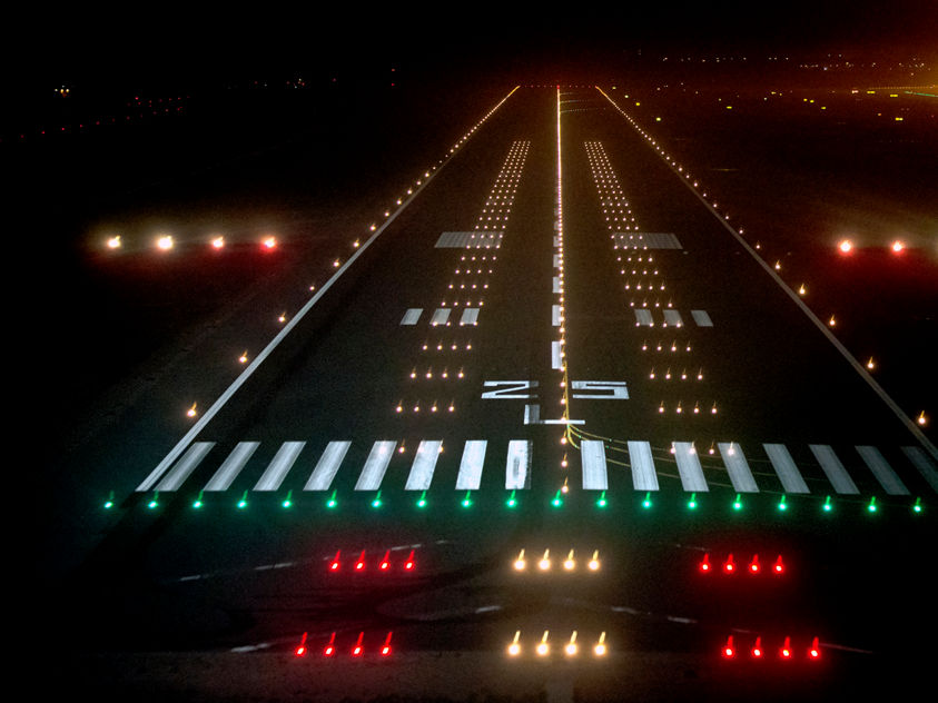Image of an airport runway at night