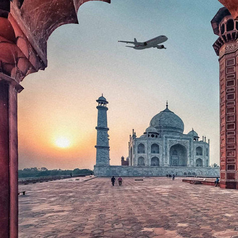 Plane flying over the Taj Mahal in Agra, India