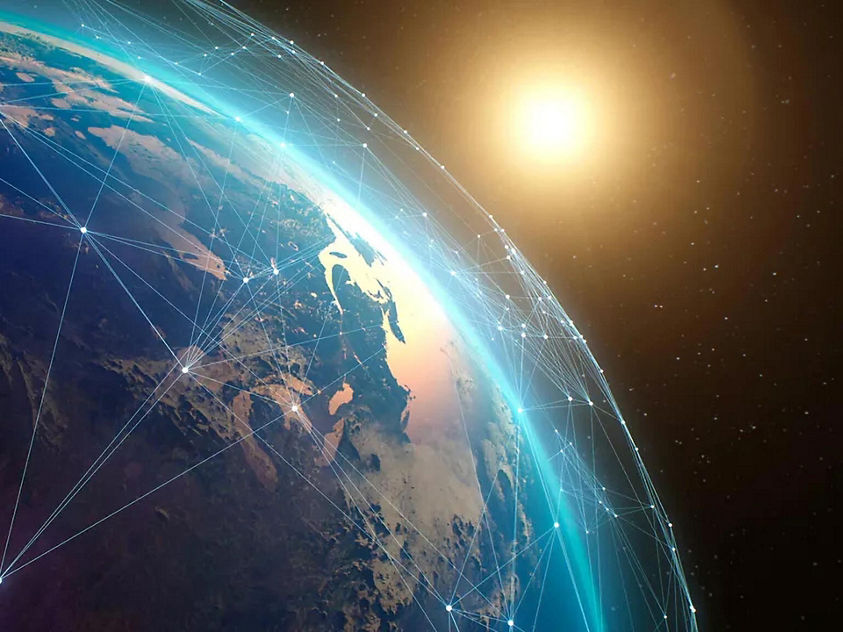 A satellite image of Earth from space, featuring a visual representation of a network connection across the planet.