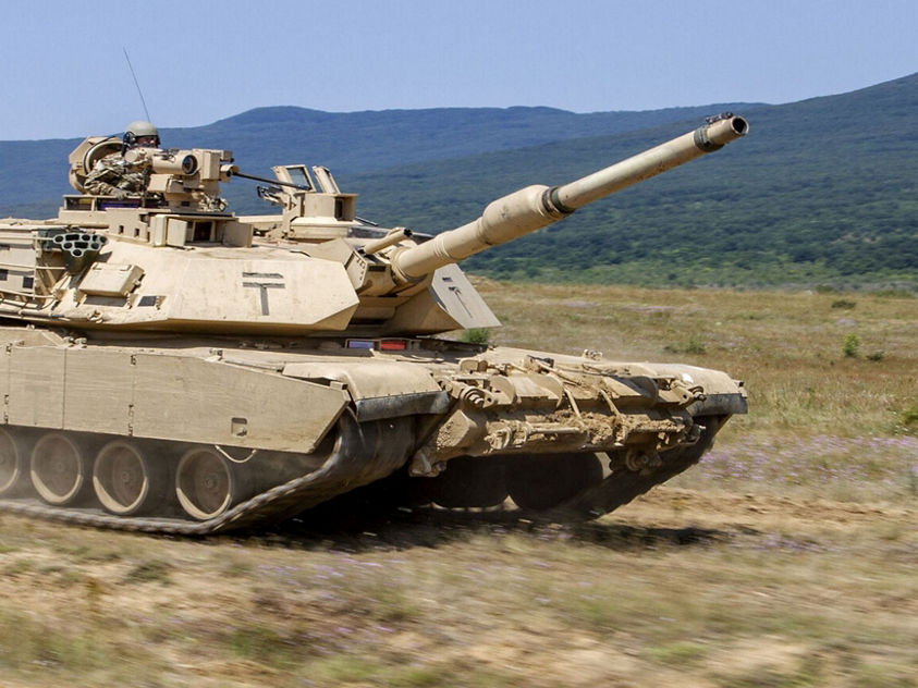 M1 Abrams tank in action on a battlefield