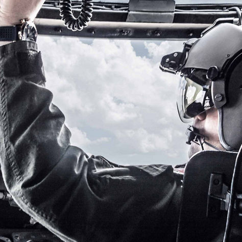 Pilot operating Honeywell Aerospace cockpit systems, highlighting precision, safety, and advanced flight technology.