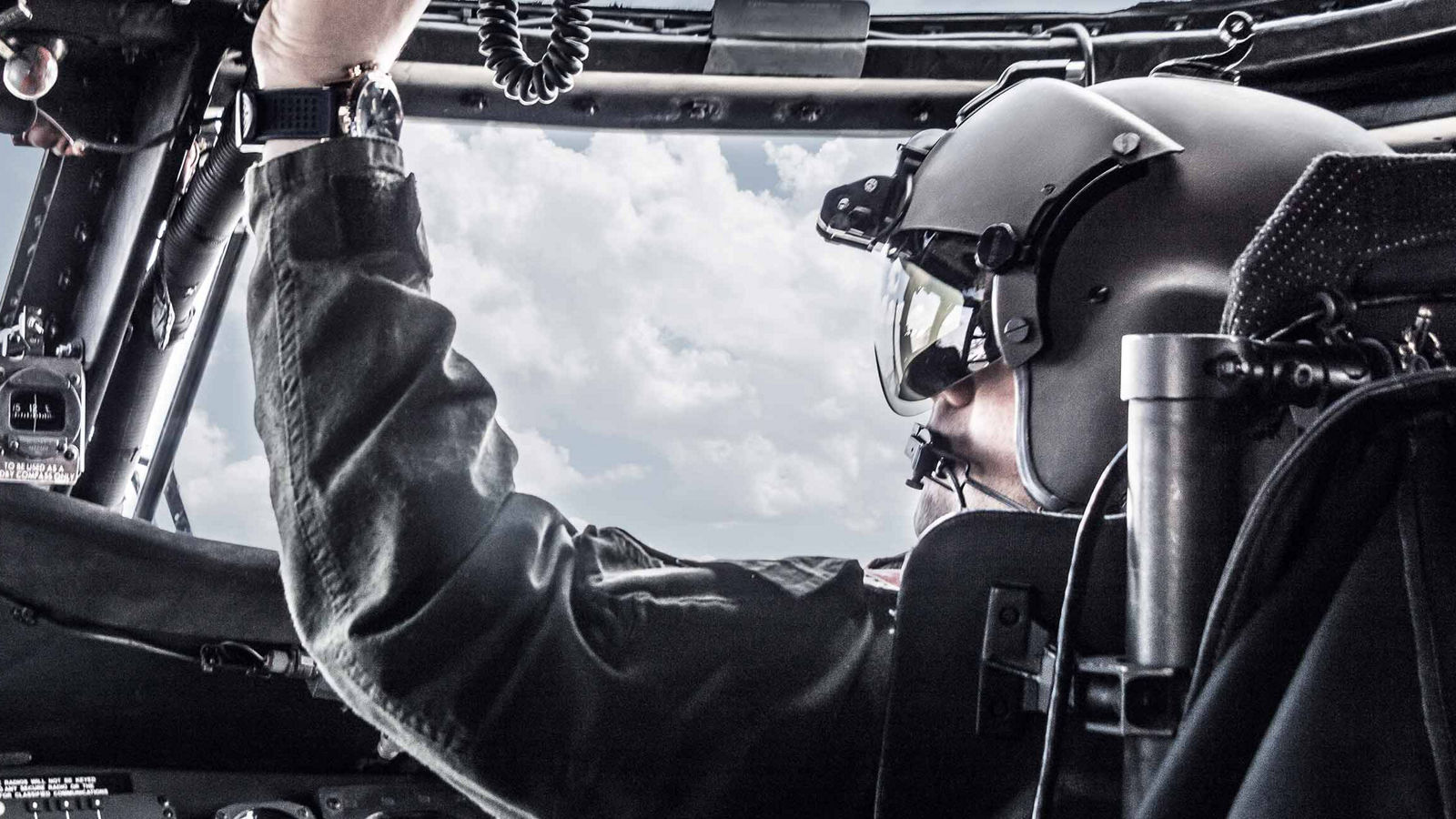 Pilot operating Honeywell Aerospace cockpit systems, highlighting precision, safety, and advanced flight technology.