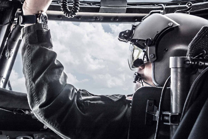 Pilot operating Honeywell Aerospace cockpit systems, highlighting precision, safety, and advanced flight technology.