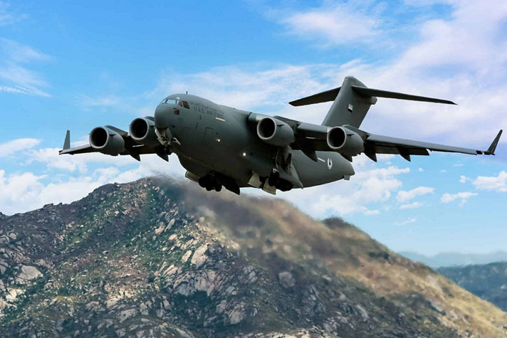 an image of boeing c-17 globemaster III flying