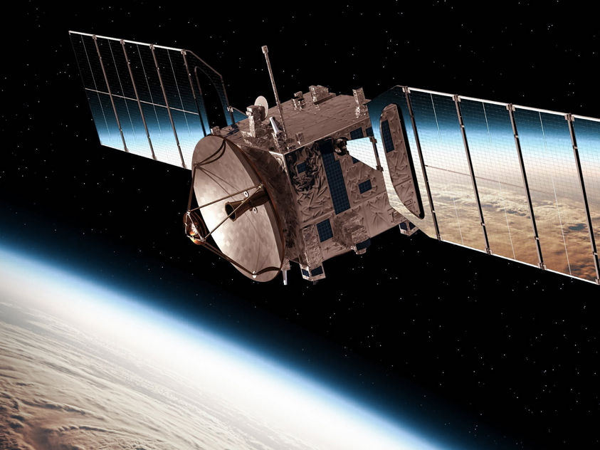 Satellite orbiting above Earth’s horizon