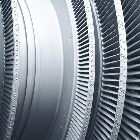A detailed close-up of modern metal turbine blades used in high‑performance aerospace engines. The image highlights the precision engineering, curved blade geometry, and durable materials designed to optimize airflow and efficiency in advanced turbine systems.