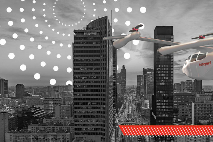 A red and white Honeywell-branded flying vehicle navigates a grayscale cityscape of towering skyscrapers, highlighting advanced urban air mobility.