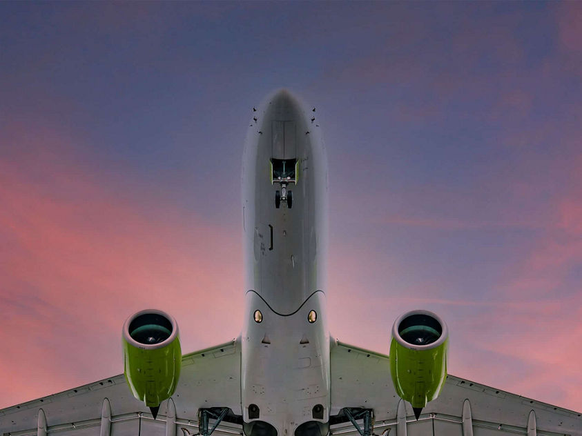 Plane in sky hero