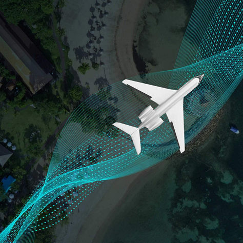 Aircraft flying over a sustainable green city with parks and modern buildings