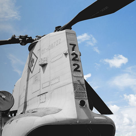 A Boeing Vertol CH-46 Sea Knight helicopter with a prominent top-mounted propeller, showcasing its military design.