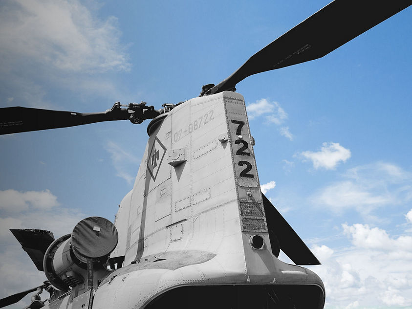 A Boeing Vertol CH-46 Sea Knight helicopter with a prominent top-mounted propeller, showcasing its military design.